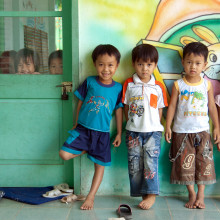 Group of small children standing outside a classroom