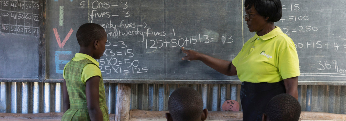 A teacher instructs pupils at a low-cost private school in Uganda, east Africa.